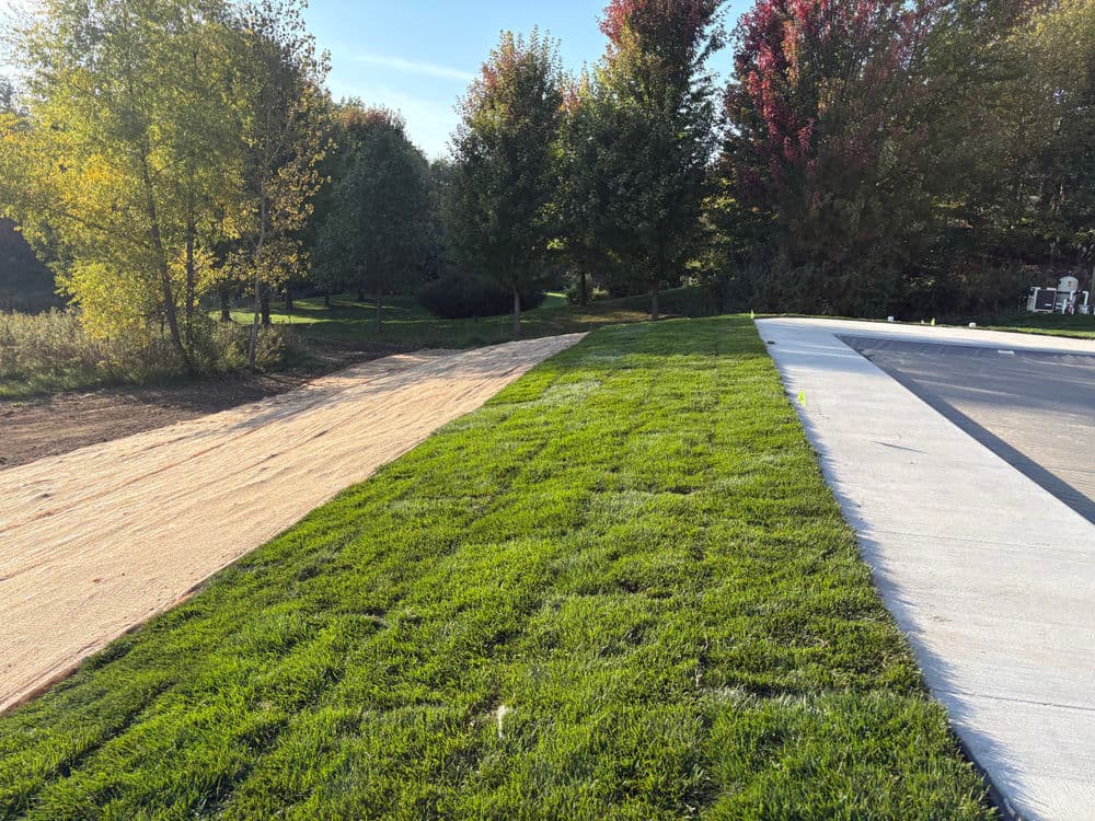 Boulder Wall Extension, Seeding, and Landscaping in Hudson WI image